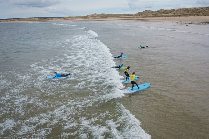 2 hour group lesson (3-16 people) - Learning on the sand before entering the water