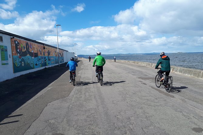 Edinburgh Sky to Sea Bike or E-Bike Tour with Transfer by TBC - Holyrood, Parliament, and the climb to Arthur’s Seat