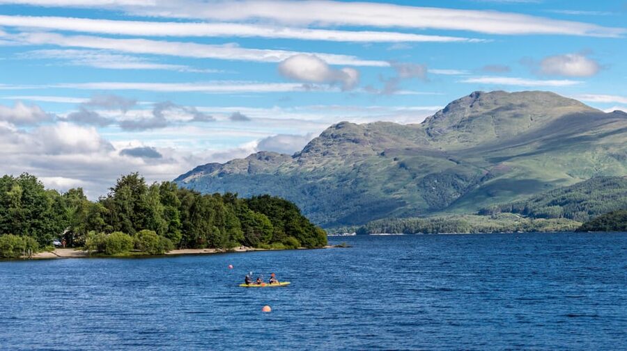 From Glasgow; Loch Lomond and Highlands Private Day Tour - Luss: cottages, a pier, and a very old churchyard